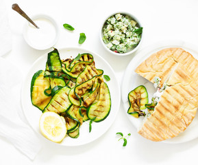 Grilled zucchini with sauce and pitta. view from above. Selective focus.
