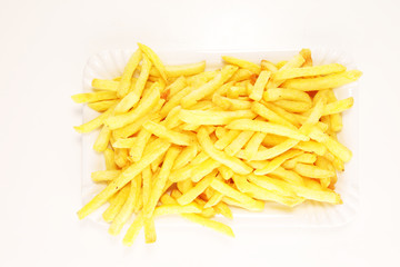 Tasty french fries on table background