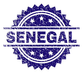 SENEGAL stamp seal watermark with distress style. Blue vector rubber print of SENEGAL tag with retro texture.