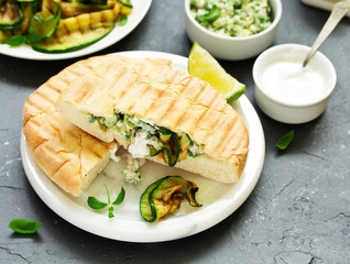 Grilled zucchini with sauce and pitta. view from above. Selective focus.