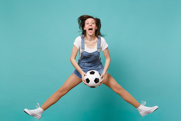 Dizzy woman football fan cheer up support favorite team holding soccer ball jumping isolated on...