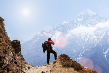 Mountaineer photographing a beauty of a nature at Himalayas mountain