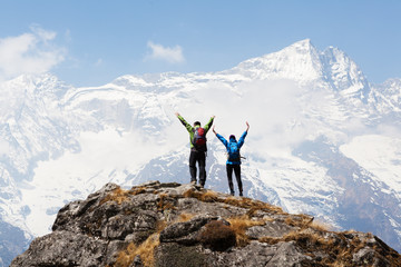 Happy mountaineers at the top of the mountain, winter season,Copy space