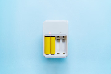 Picture of charger with yellow batteries