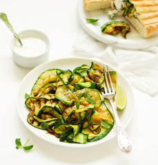 Grilled zucchini with sauce and pitta. view from above. Selective focus.