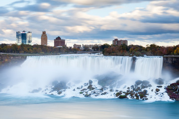Fototapeta na wymiar Niagara Falls. A close up long exposure view of the American Falls, a part of the Niagara Falls. The falls straddle the border between America and Canada.