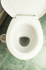 New white ceramic toilet bowl indoors, top view