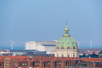 Dome of Royal Castle Amalienborg, Denmark with wind turbines in the background