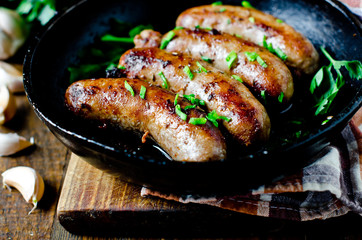 Homemade sausages from turkey (chicken) fried in a frying pan