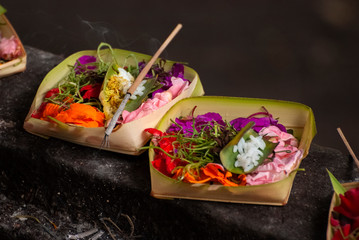Balinese Hindu Temple Offerings Called Canang. Canang sari is one of the daily offerings made by Balinese Hindus to thank the Sang Hyang Widhi Wasa in praise and prayer. Seen everywhere in Bali.
