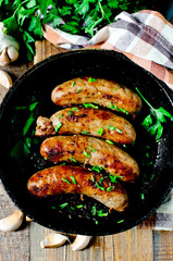 Homemade sausages from turkey (chicken) fried in a frying pan