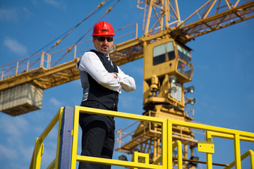 worker  engineer on crane of construction site
