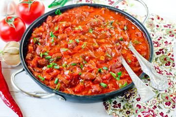 Stewed beans with tomatoes and vegetables