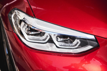 Headlights of red car
