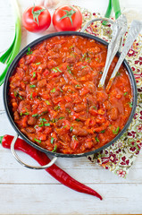 Stewed beans with tomatoes and vegetables