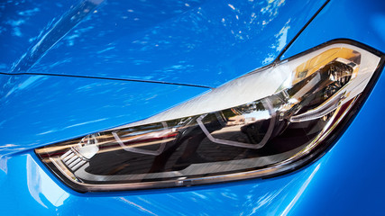 Headlights of blue car