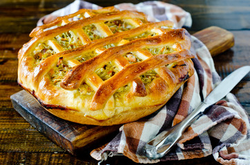 Pie with cabbage and vegetables