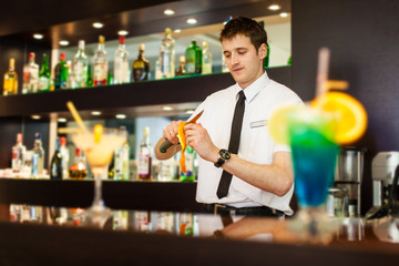 young bartender with cocktail