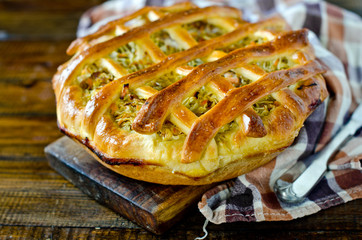 Pie with cabbage and vegetables
