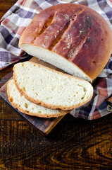 Homemade bread on a dark wooden background