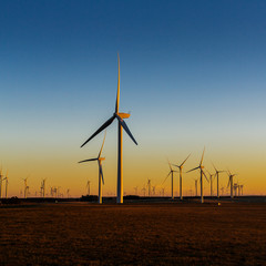 Renewable energy wind farm at sunset