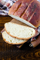 Homemade bread on a dark wooden background