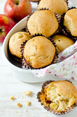 Apple muffins on a white wooden background