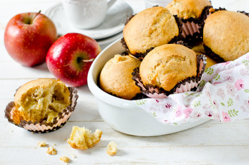 Apple muffins on a white wooden background