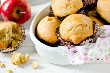 Apple muffins on a white wooden background