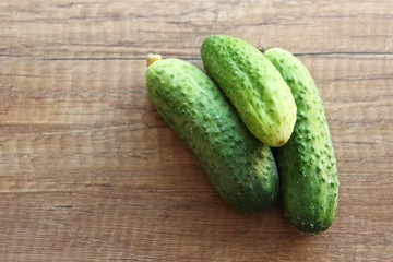 Cucumber on wooden background, vegetables