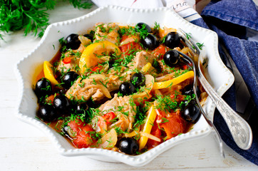 Chicken (turkey) stewed with tomatoes, olives and lemon in Italian style