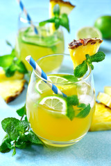Homemade summer lemonade with pineapple, orange and lime.