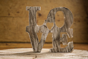  Word love in wood type, love concept.