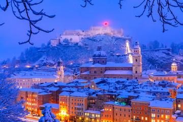Salzburg, Austria: Heavy snow on the historic city of Salzburg with famous Festung Hohensalzburg...