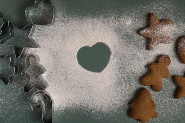 Cooking gingerbread cookies from dough using different forms - heart, star, Christmas tree, men. Home baking. 