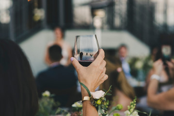 woman holding glass of wine