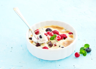 Zabaglione with champagne and berries. French dessert.