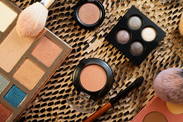 fashion set of new cosmetics eyeshadows palettes with brushes. close up