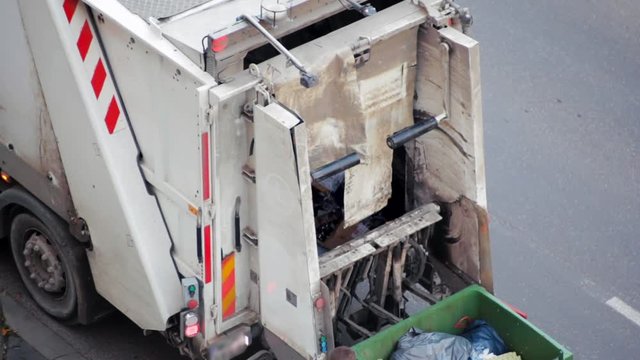 Garbage Truck Car Lifting the Container with Trash. Rubbish Collection Vehicle Loading Garbage