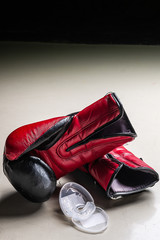 boxer teeth protection and pair of boxing gloves