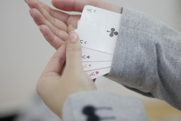 Concept image of a person hiding an ace up their sleeve.