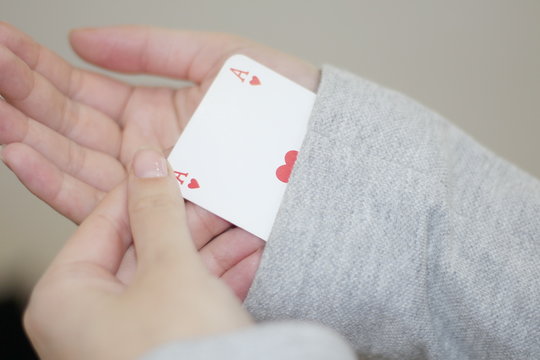 Concept Image Of A Person Hiding An Ace Up Their Sleeve.