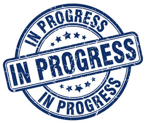 in progress blue grunge round vintage rubber stamp