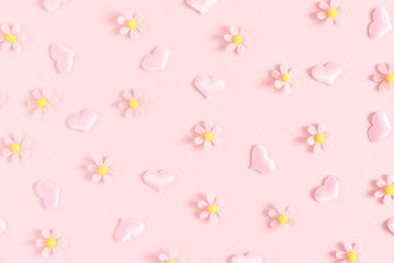 Valentine's Day background. Floral decor and pink hearts on light pink pastel background. Valentines day concept, design. Flat lay, top view, copy space 