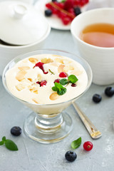 Zabaglione with champagne and berries. French dessert.