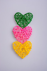 Three colorful hearts on top of each other - 245442615