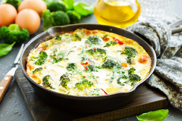 Frittata with vegetables and broccoli. View from above. Selective focus.