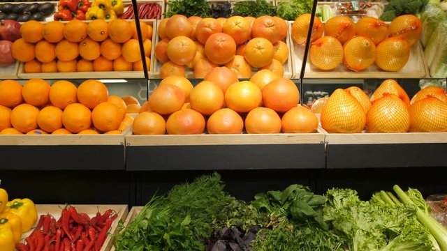 Various choice of fresh organic vegetables and fruits on shelf in supermarket. Abundance of eco-friendly products for healthy eating and dieting on shop shelf at green grocery store.