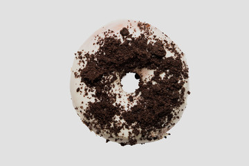 White chocolate glazed doughnut with chocolate sprinkle on top on white background. High resolution image for food industry.