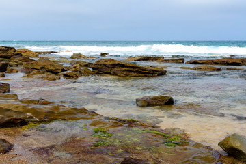 Fototapeta na wymiar rock formation in the beach